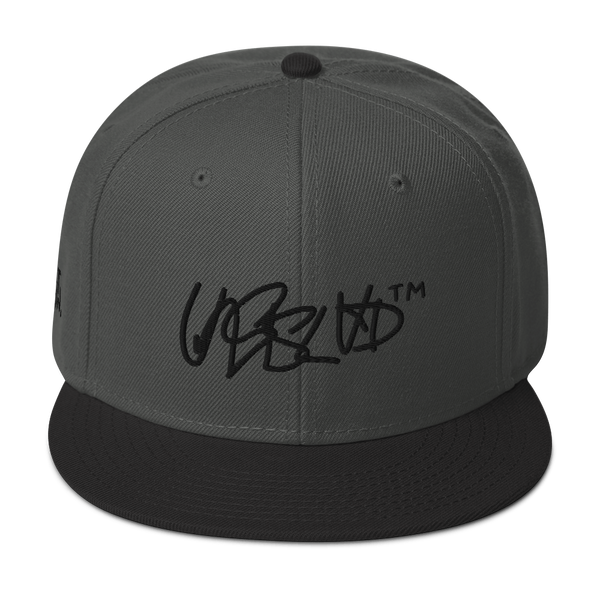 Snapback Hat- UNRSLVD TAG LOGO - 'what now' on side - embroidered