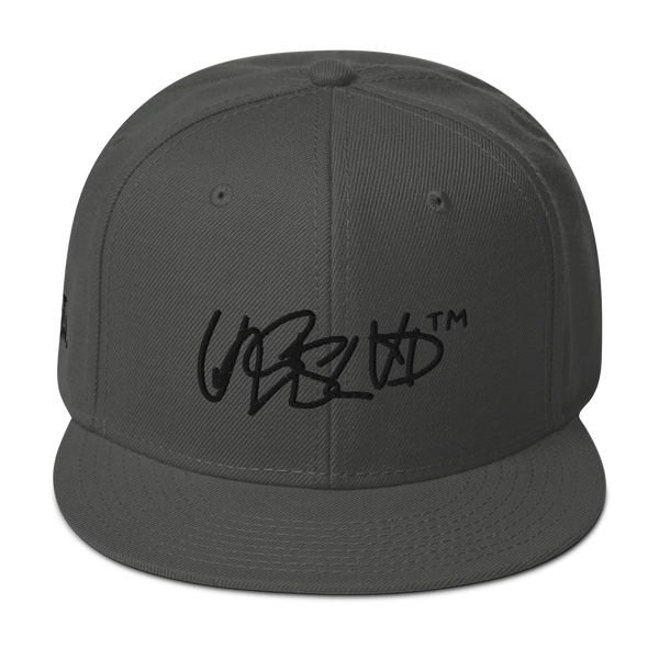 Snapback Hat- UNRSLVD TAG LOGO - 'what now' on side - embroidered
