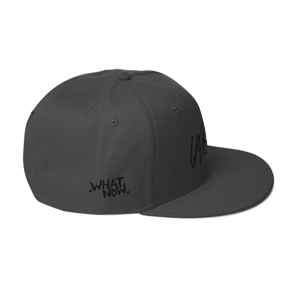 Snapback Hat- UNRSLVD TAG LOGO - 'what now' on side - embroidered