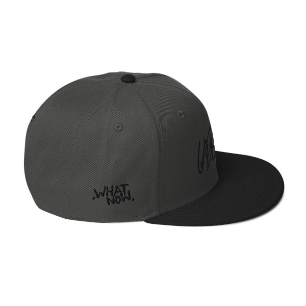 Snapback Hat- UNRSLVD TAG LOGO - 'what now' on side - embroidered